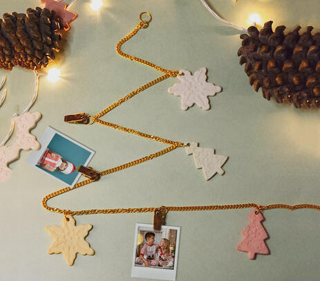 Photo garland with christmas adornments