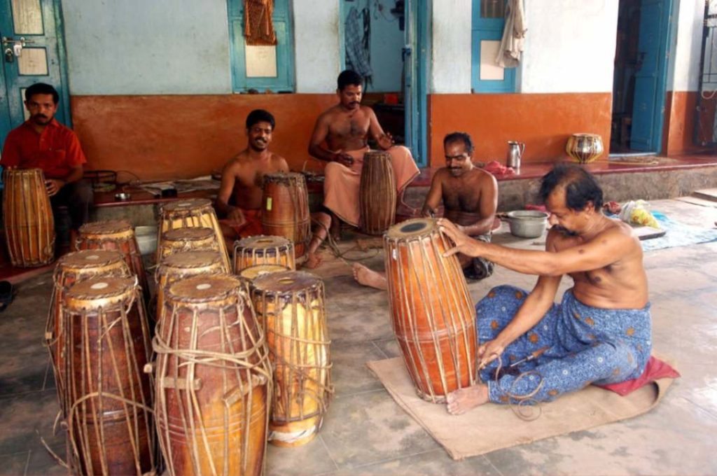 Craftsmen working on a maddalam