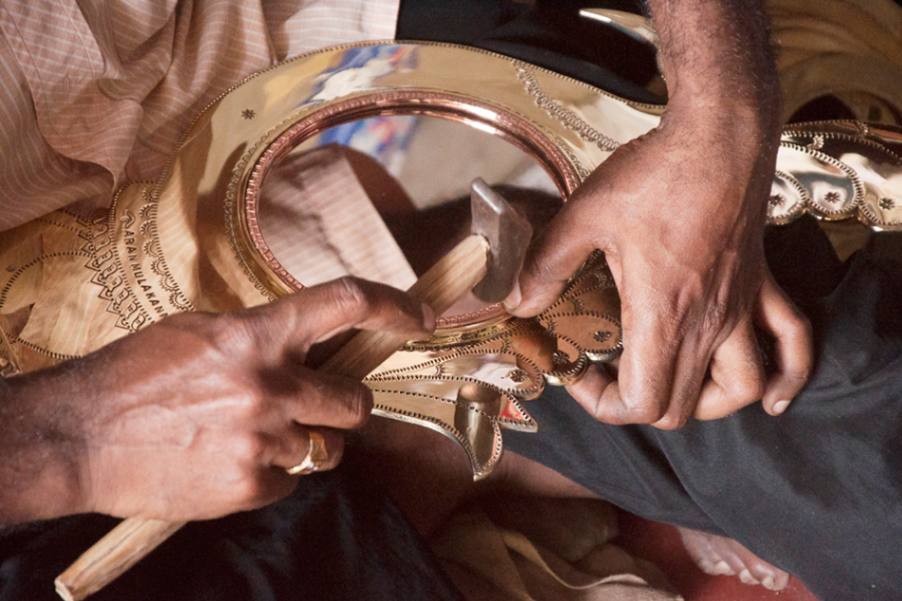 Artisan working on an Aranmula Kannadi mirror