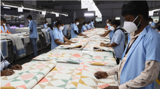 Sarita Handa’s factory workers quality checking the products before they can be shipped out | Image Source: Sarita Handa exports